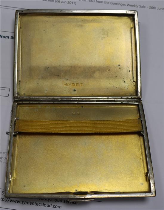 Two silver compacts and two engine turned silver cigarette cases including one modelled as a book.